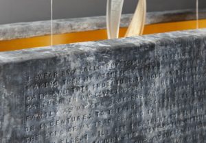 Close up of stone with text engraved into it
